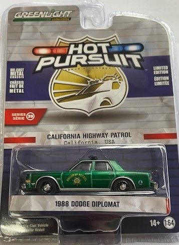 GREEN42970-CVERT - DODGE Diplomat 1988 Green Patrol of Califonia HOT PURSUIT serie 39 en blister - 1