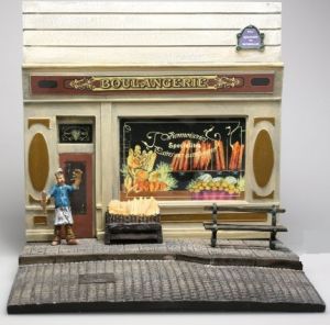 AKI0128 - Diorama frente panadería con pavimento y figura dimensión H14 cm x A 15 cm x P14 cm