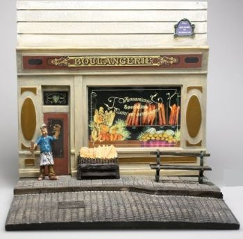 AKI0128 - Diorama frente panadería con pavimento y figura dimensión H14 cm x A 15 cm x P14 cm